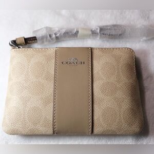 Coach Wristlet Wallet - Cream and Silver

Length: 6.25"
Height: 4.0"
Width: 0.5"